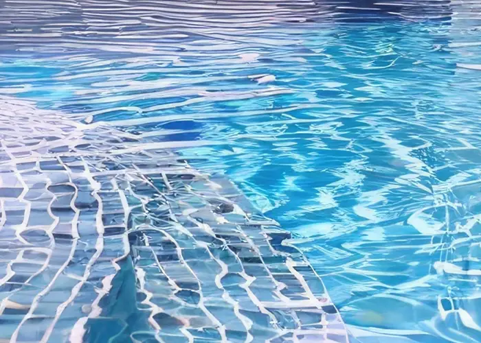 Fotografía de una piscina con forma irregular en una comunidad de vecinos en Calafell